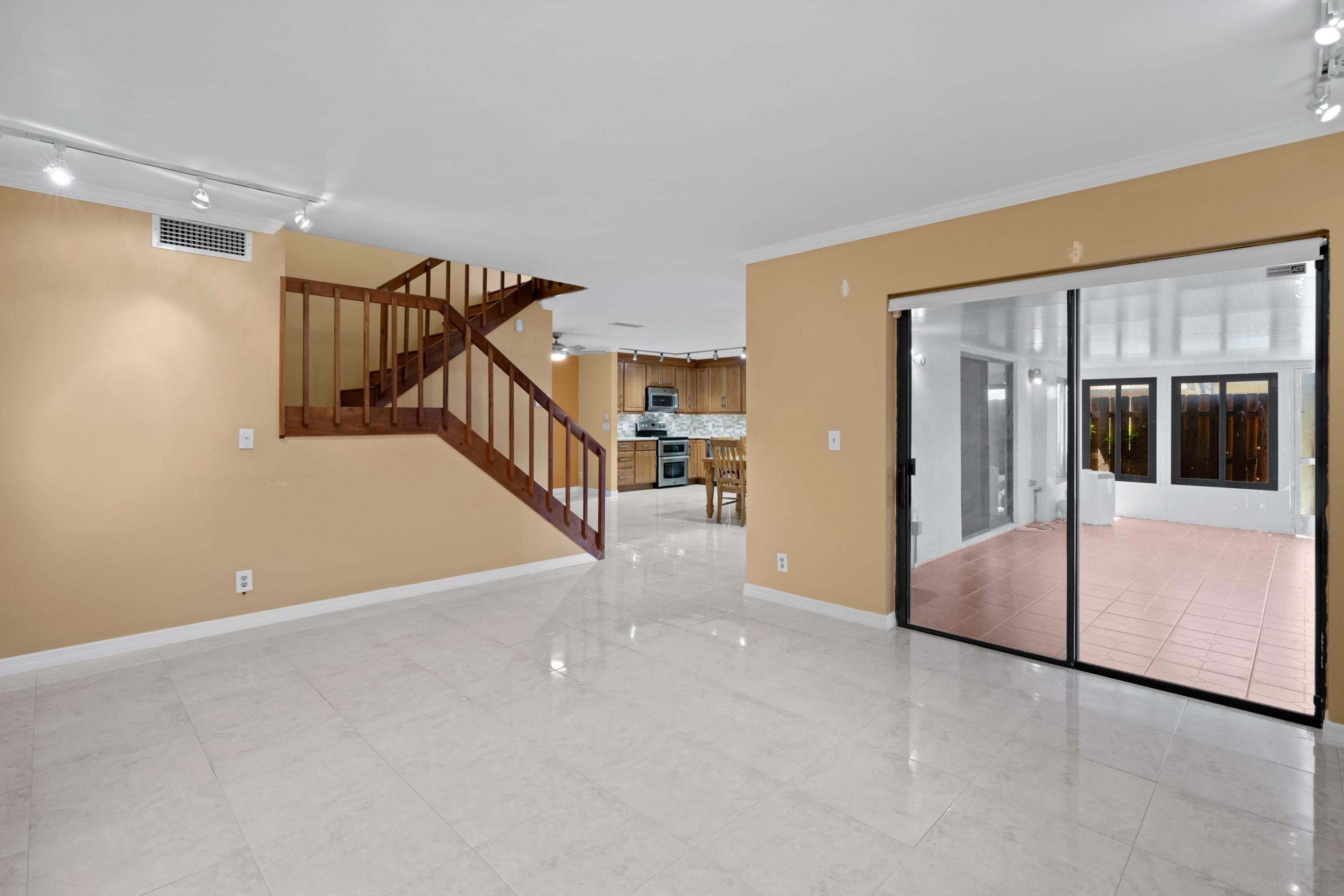109 Woodland Road Palm Springs, FL 33461 - Photo 11 of 20 a view of an empty room with stairs