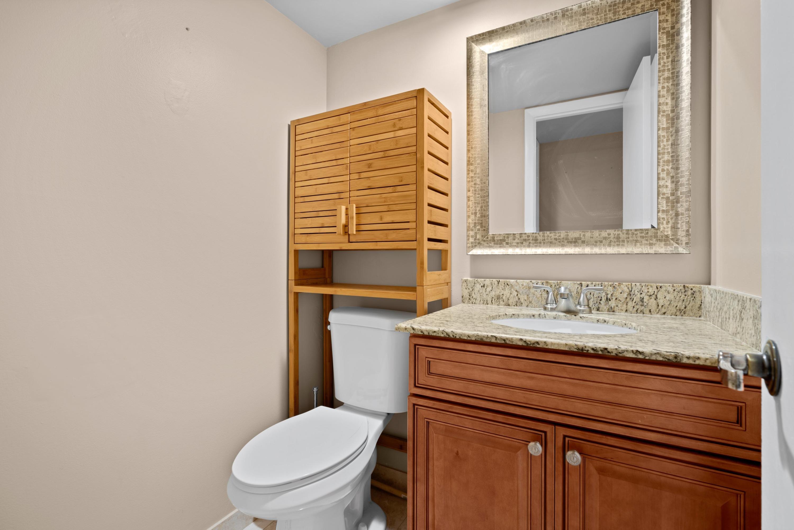109 Woodland Road Palm Springs, FL 33461 - Photo 12 of 20 a bathroom with a toilet and a sink
