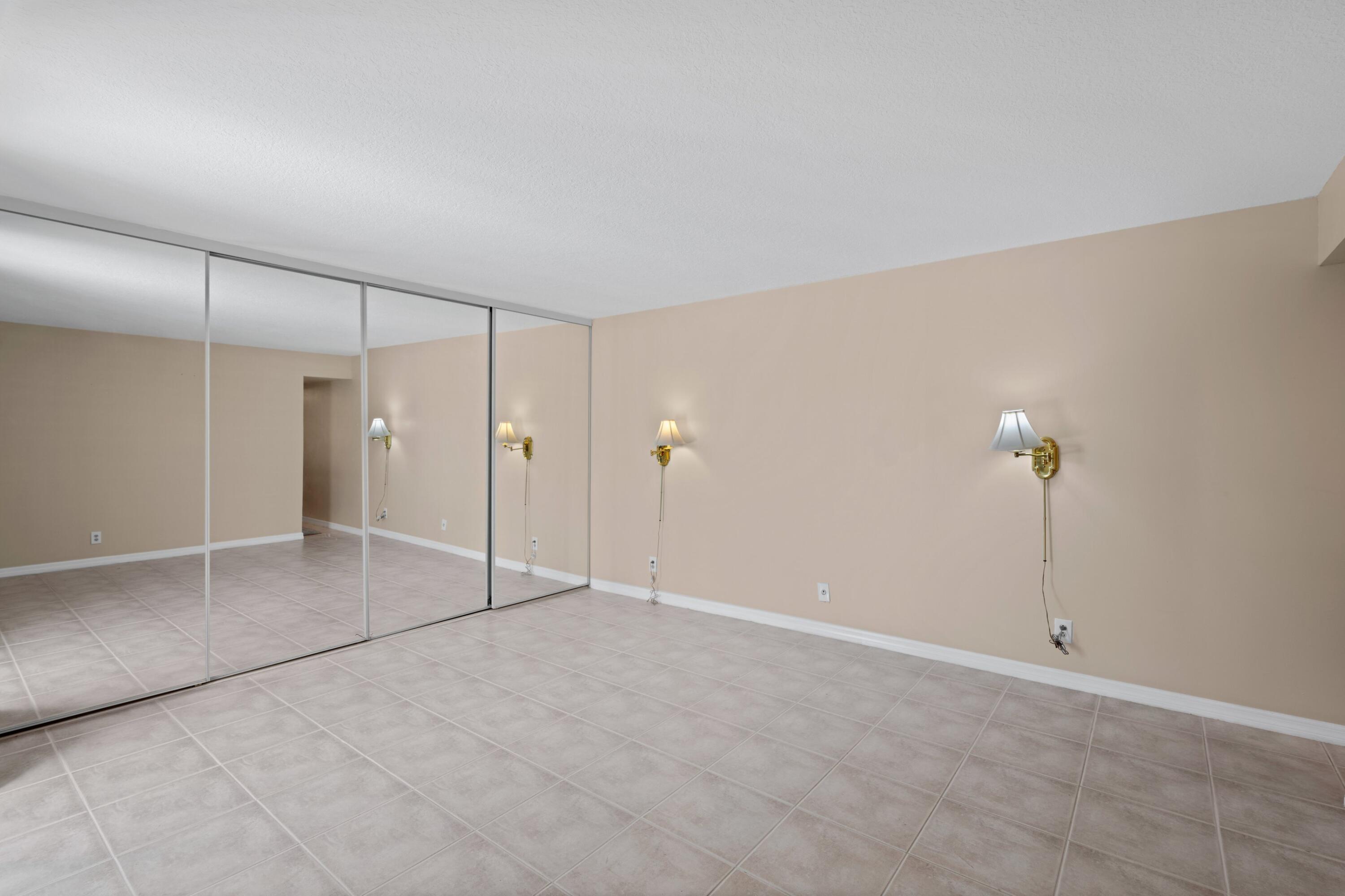 109 Woodland Road Palm Springs, FL 33461 - Photo 17 of 20 a view of an empty room