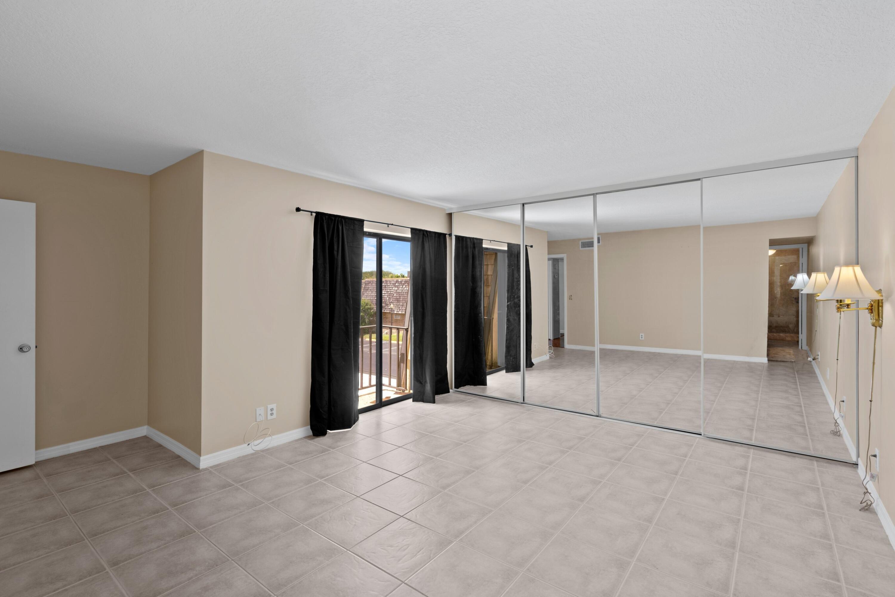 109 Woodland Road Palm Springs, FL 33461 - Photo 18 of 20 a view of an empty room with a window