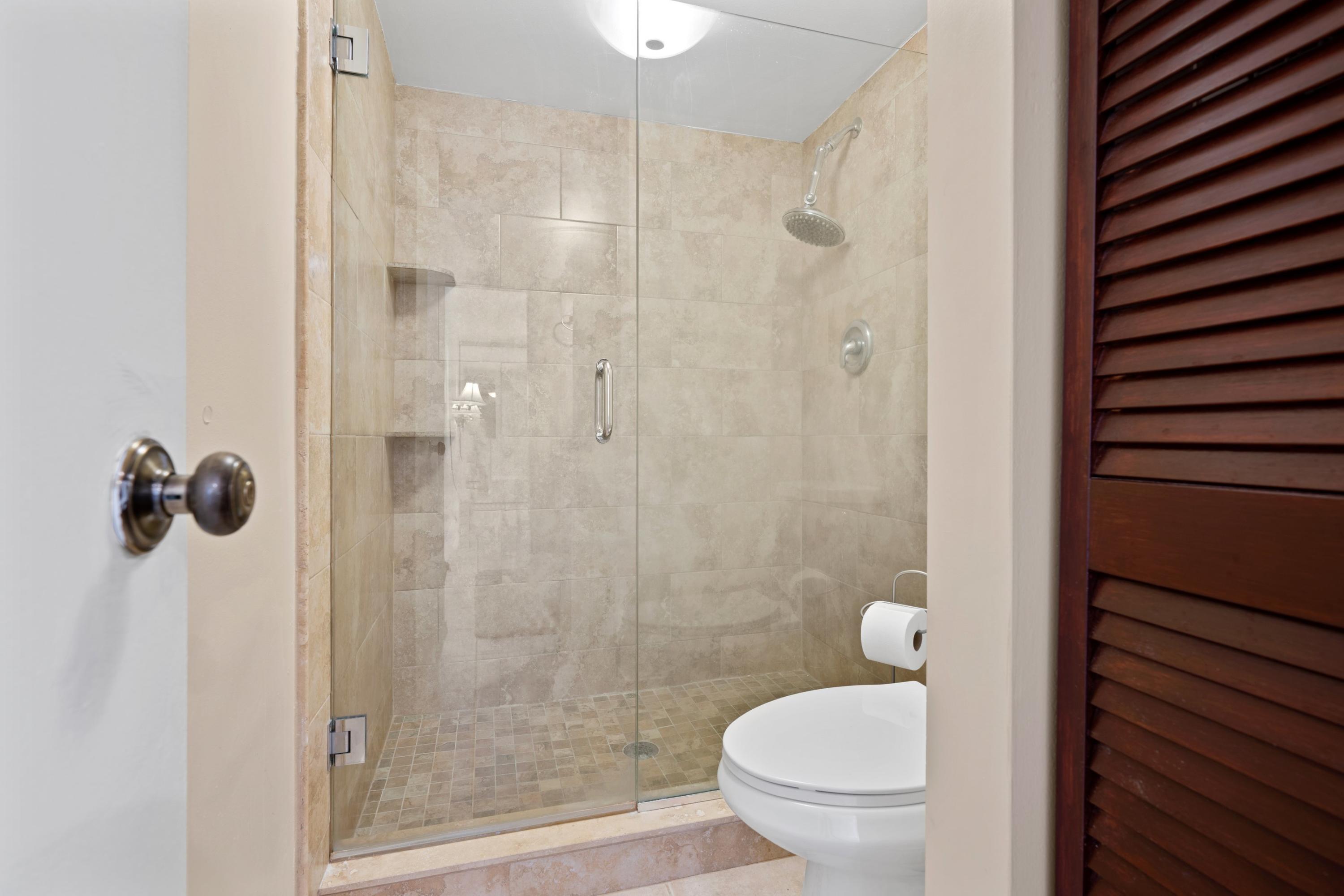 109 Woodland Road Palm Springs, FL 33461 - Photo 20 of 20 a bathroom with a toilet and a shower