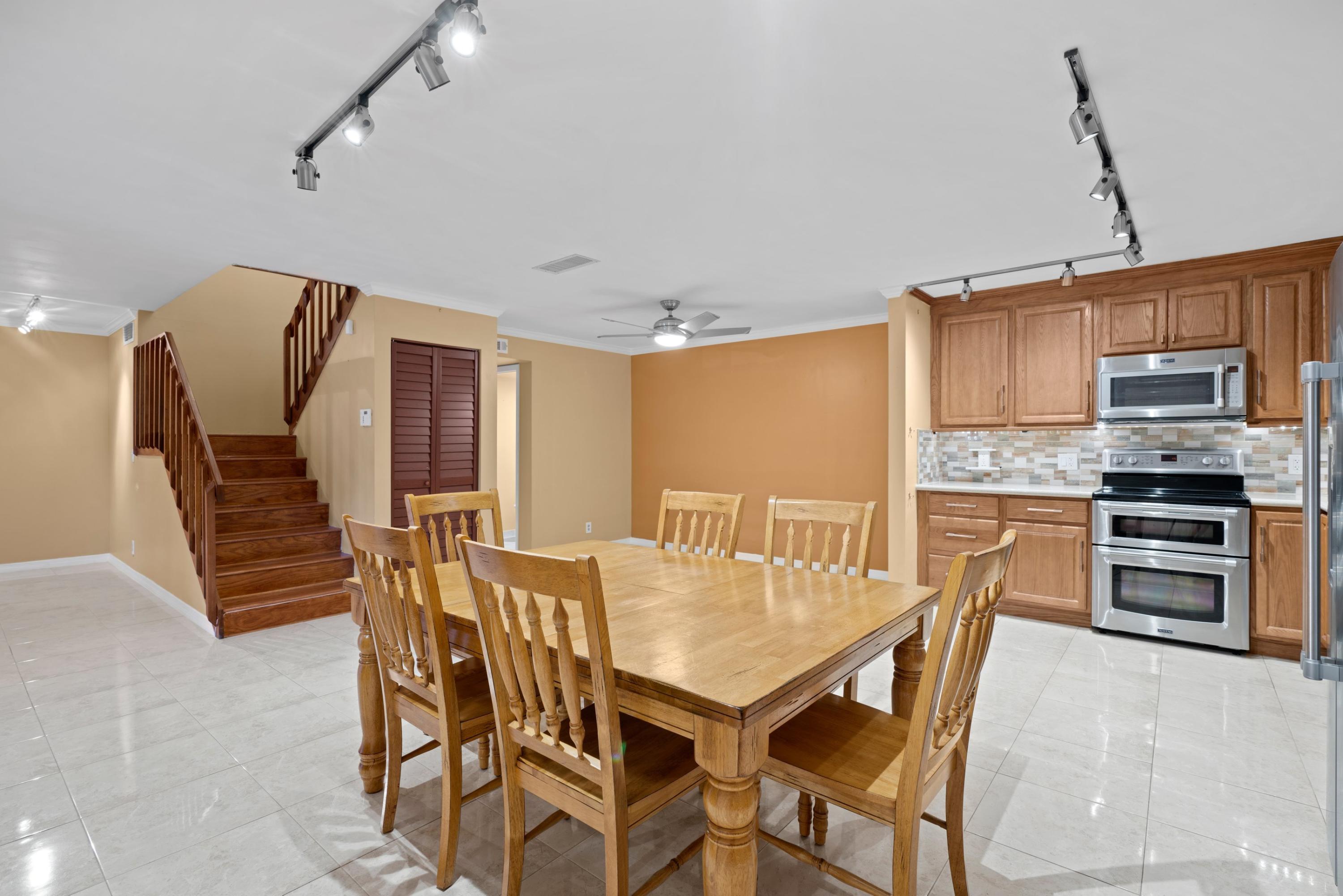 109 Woodland Road Palm Springs, FL 33461 - Photo 7 of 20 a view of a dining room with furniture