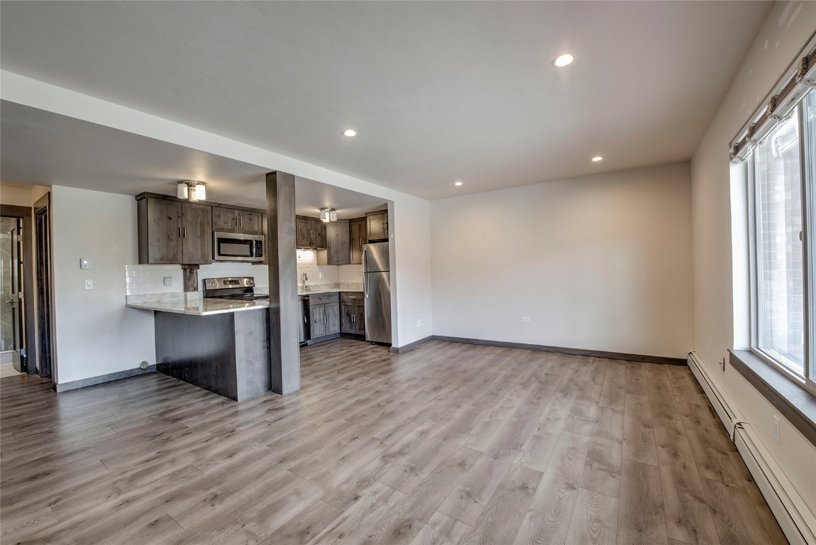 150 Evergreen Road, Unit 106 Dillon, CO 80435 - Photo 4 of 19 a view of kitchen and wooden floor