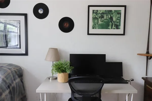 a view of a chair and table in the patio
