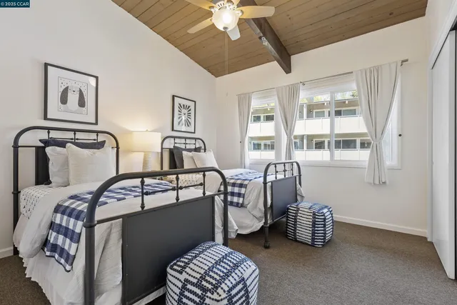 a bedroom with bed and window