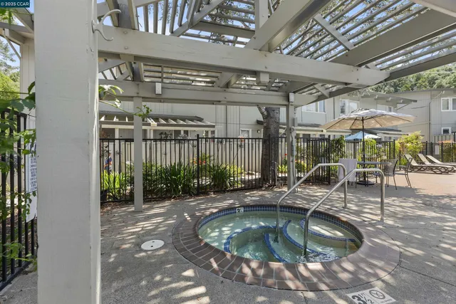 a view of a swimming pool with a patio
