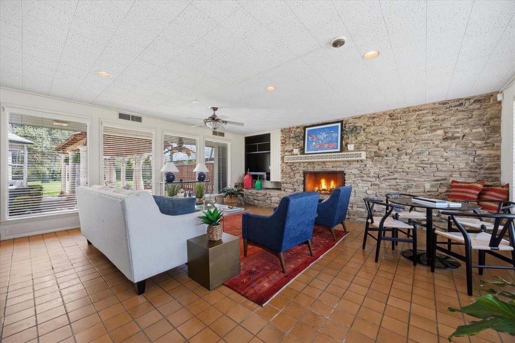 6321 Greenway Road Fort Worth, TX 76116 - Photo 19 of 40 Tiled living room with healthy amount of natural light, a fireplace, ceiling fan, and recessed lighting