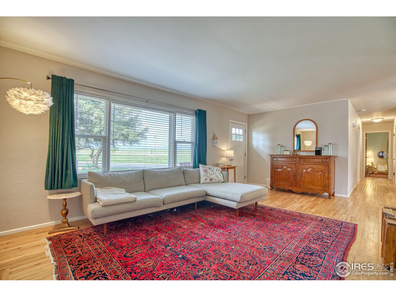 101 6th Street Frederick, CO 80530 - Photo 11 of 35 a living room with furniture and a large window