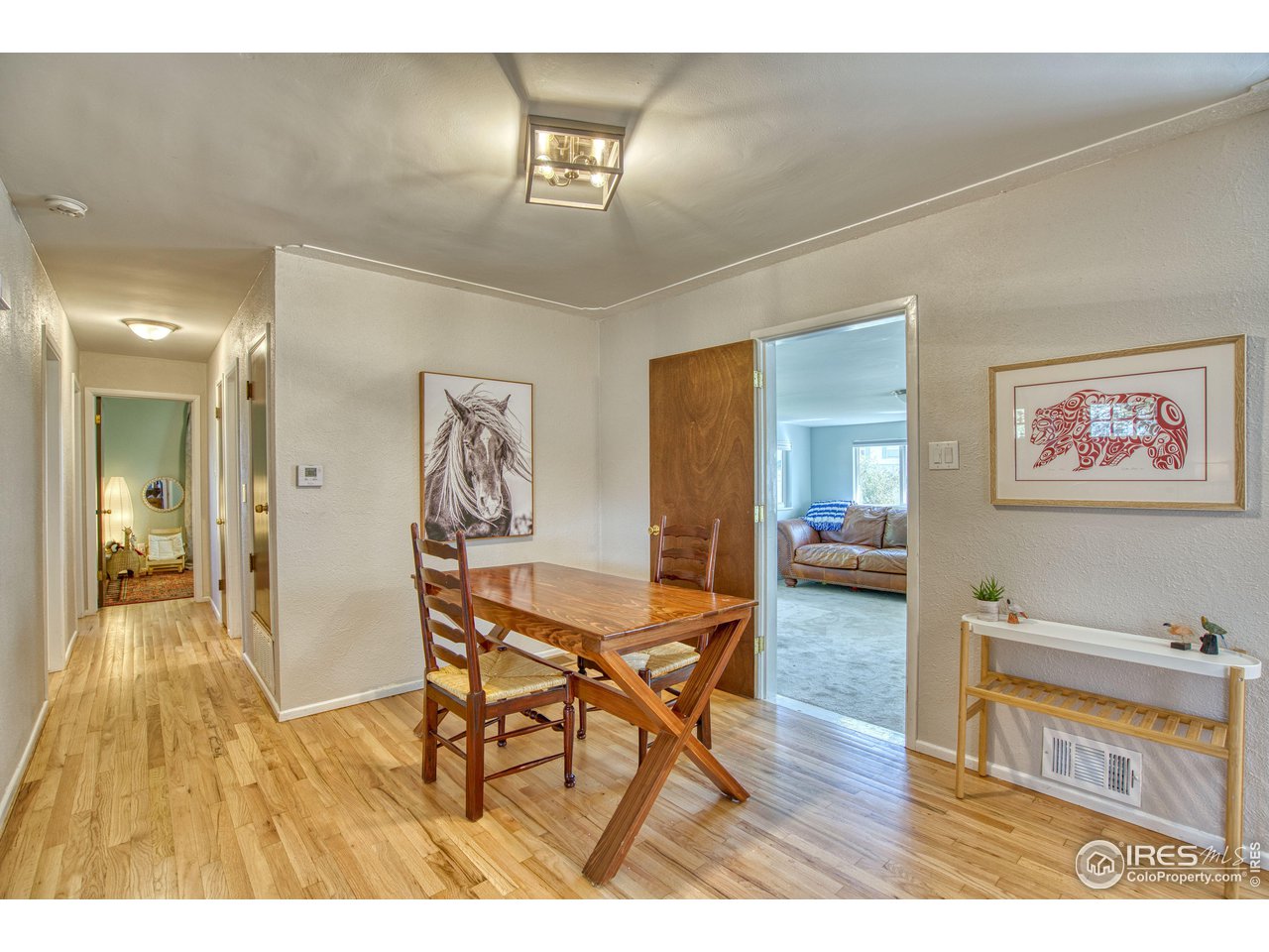 101 6th Street Frederick, CO 80530 - Photo 15 of 35 a living room with furniture and a wooden floor