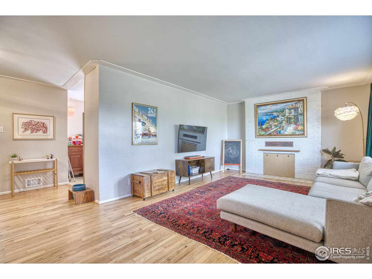 101 6th Street Frederick, CO 80530 - Photo 16 of 35 a living room with furniture and a wooden floor
