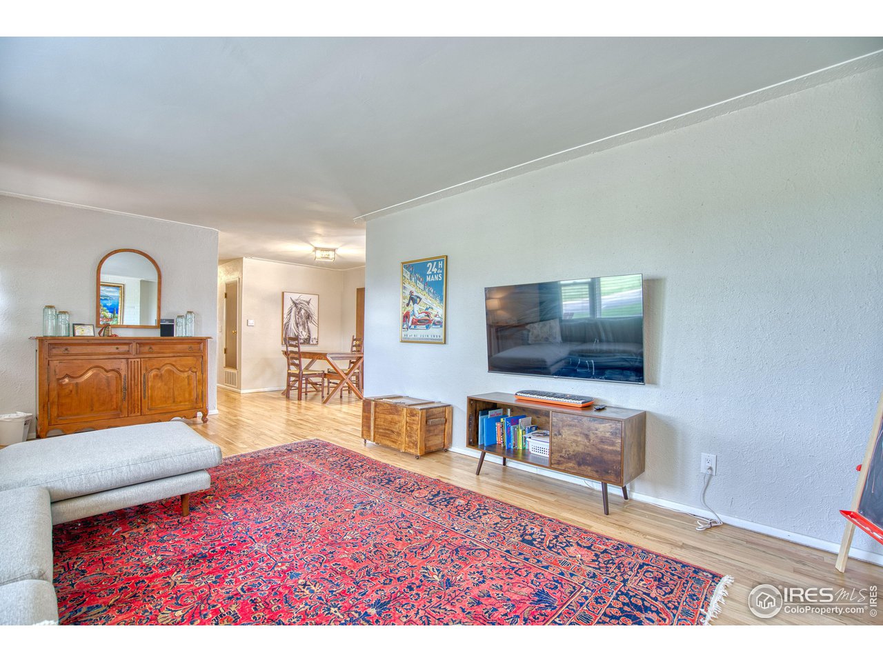 101 6th Street Frederick, CO 80530 - Photo 17 of 35 a living room with furniture and a flat screen tv