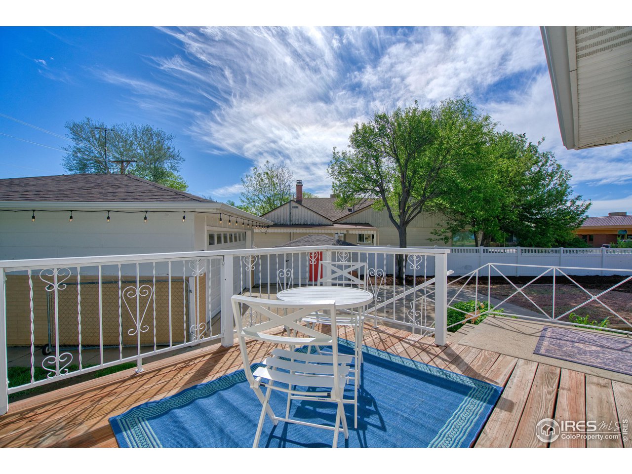 101 6th Street Frederick, CO 80530 - Photo 18 of 35 a view of a chairs and table on the wooden floor