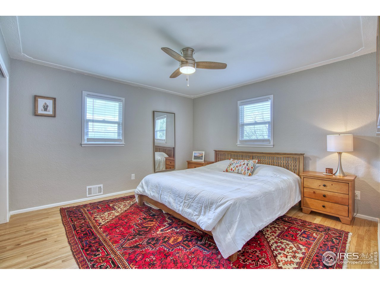 101 6th Street Frederick, CO 80530 - Photo 19 of 35 a bedroom with a large bed and a window