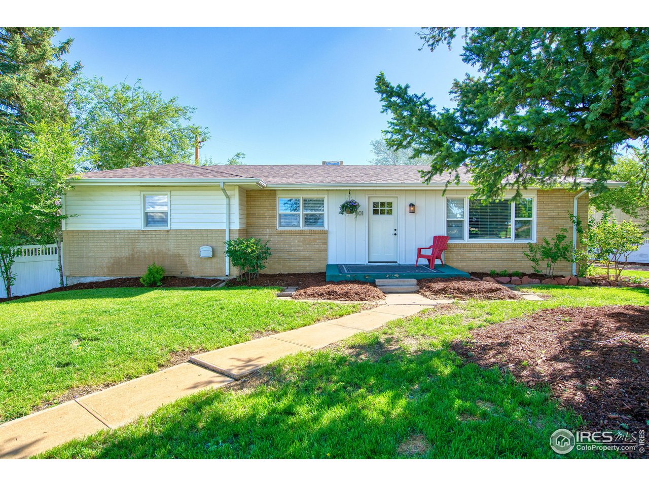 101 6th Street Frederick, CO 80530 - Photo 2 of 35 a view of a house with backyard and a garden
