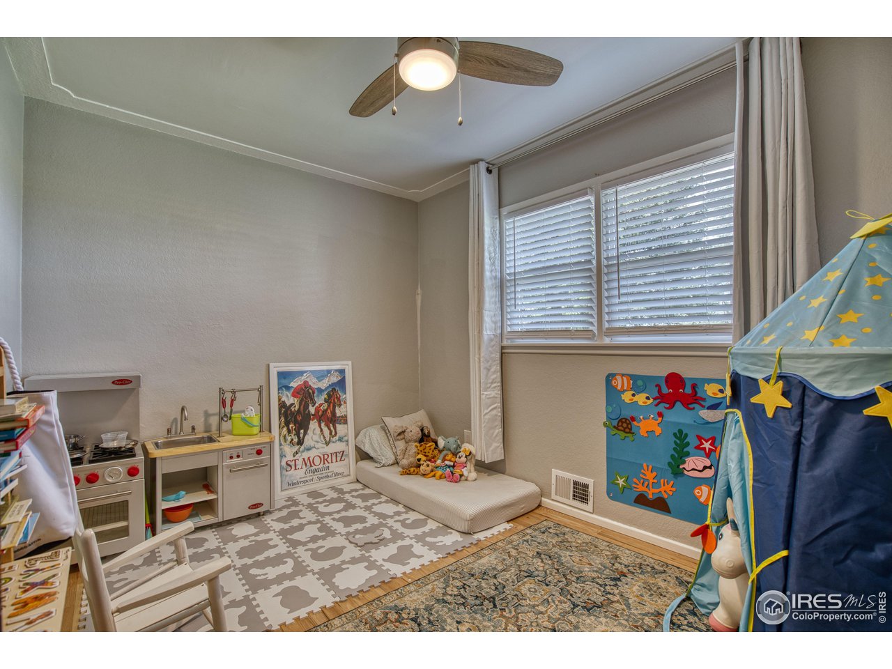 101 6th Street Frederick, CO 80530 - Photo 23 of 35 a bedroom with furniture and a window