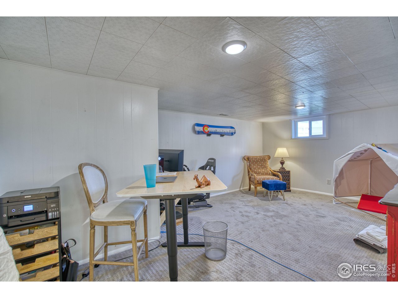 101 6th Street Frederick, CO 80530 - Photo 27 of 35 a living room with furniture and a couch