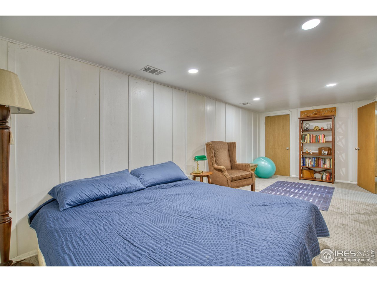 101 6th Street Frederick, CO 80530 - Photo 29 of 35 a bedroom with a bed a table and chair