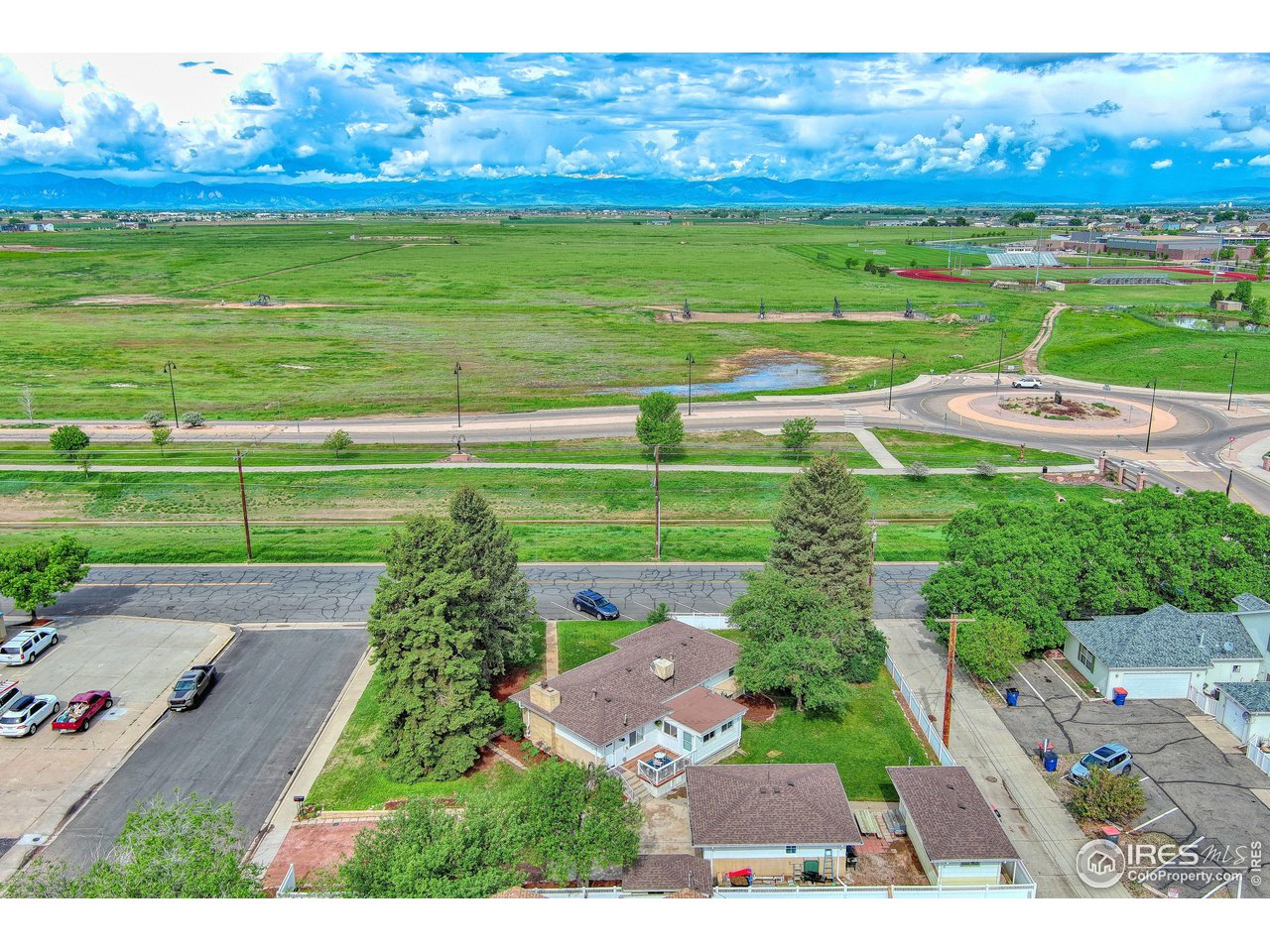 101 6th Street Frederick, CO 80530 - Photo 5 of 35 an aerial view of a golf course with a big yard