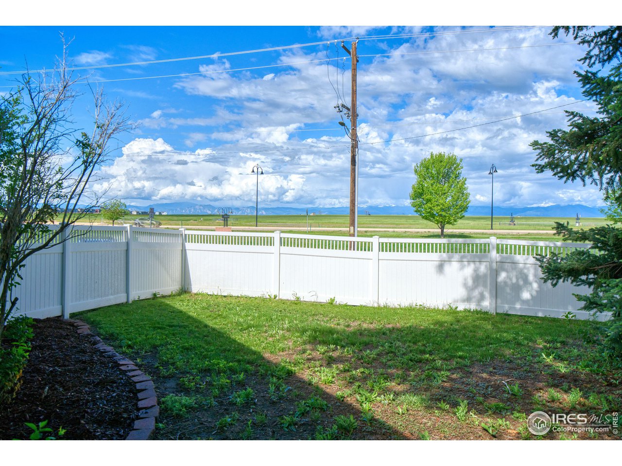 101 6th Street Frederick, CO 80530 - Photo 10 of 35 a view of a lake with a big yard