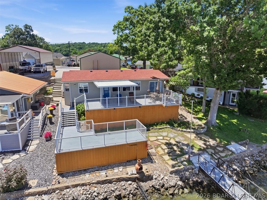 2202 Spring Cove Road Sunrise Beach, MO 65079 - Photo 3 of 57 Mulitple decks and only steps from your dock