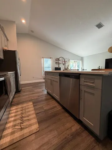 a bathroom with a double vanity sink and mirror
