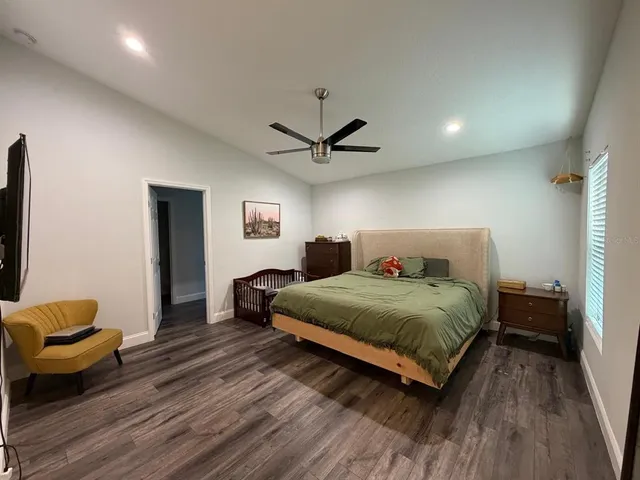 a white toilet sitting next to a shower