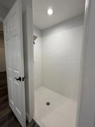 a kitchen with a sink a stove and cabinets