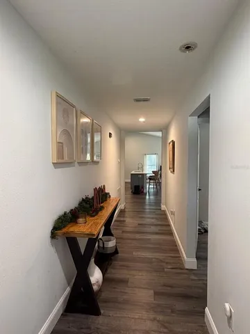 a man sitting on a bench in a hallway