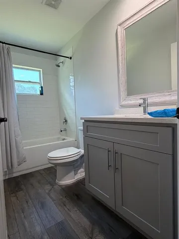 a bedroom with a bed and a desk