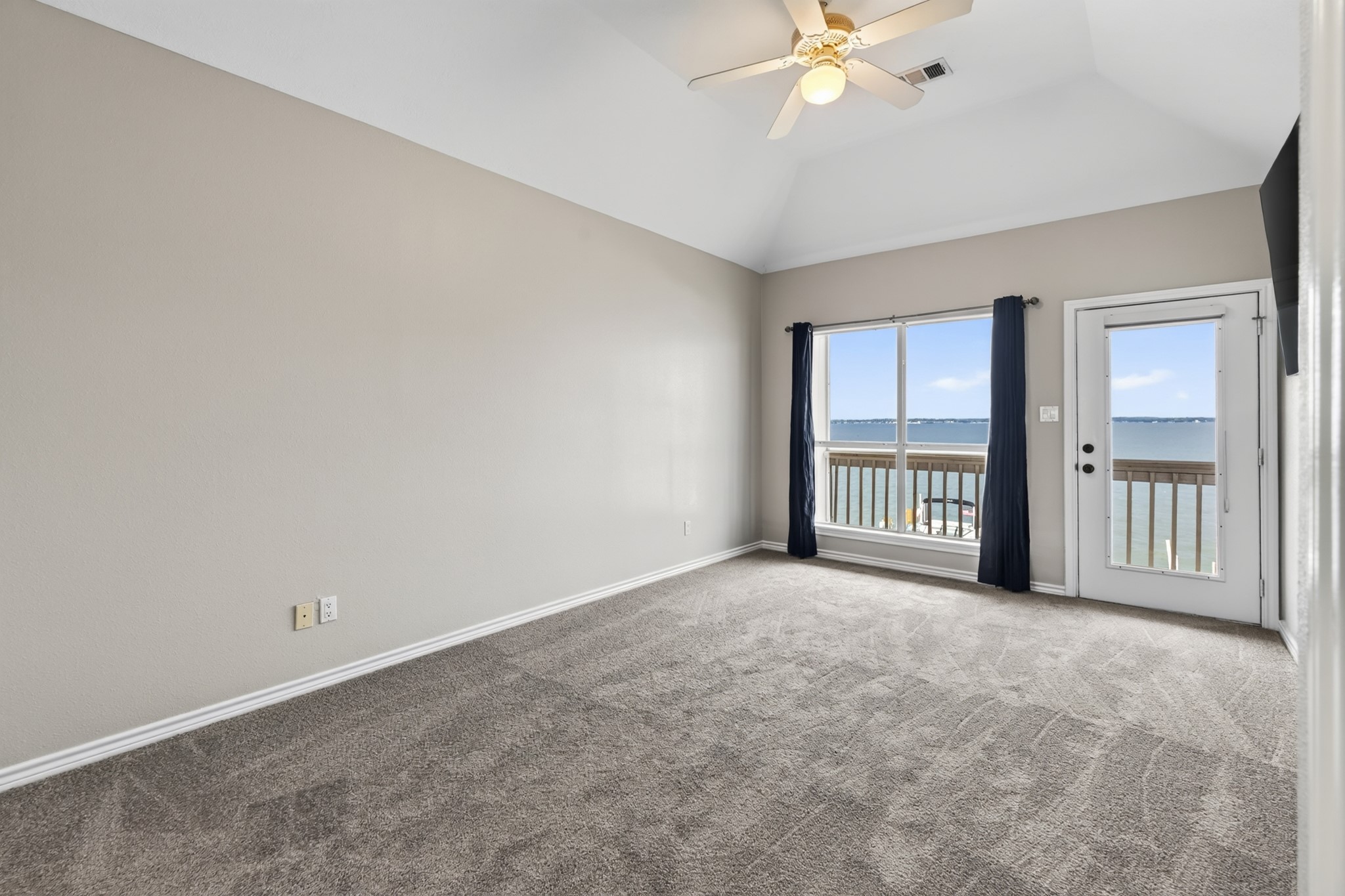 6 Regency Point Montgomery, TX 77356 - Photo 28 of 43 Primary bedroom with beautiful lake views and access to the second-floor balcony.