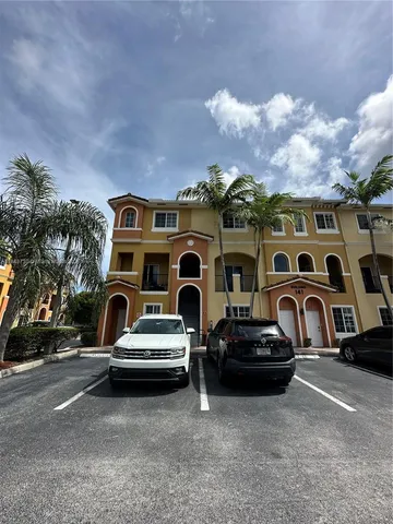 a front view of a house with parking space