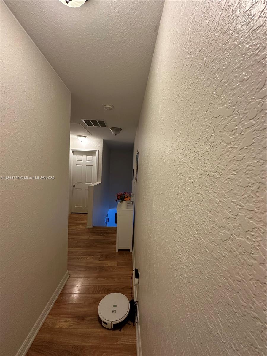 141 Northwest 2nd Avenue, Unit 2 Hallandale Beach, FL 33009 - Photo 11 of 21 a view of empty room with wooden floor