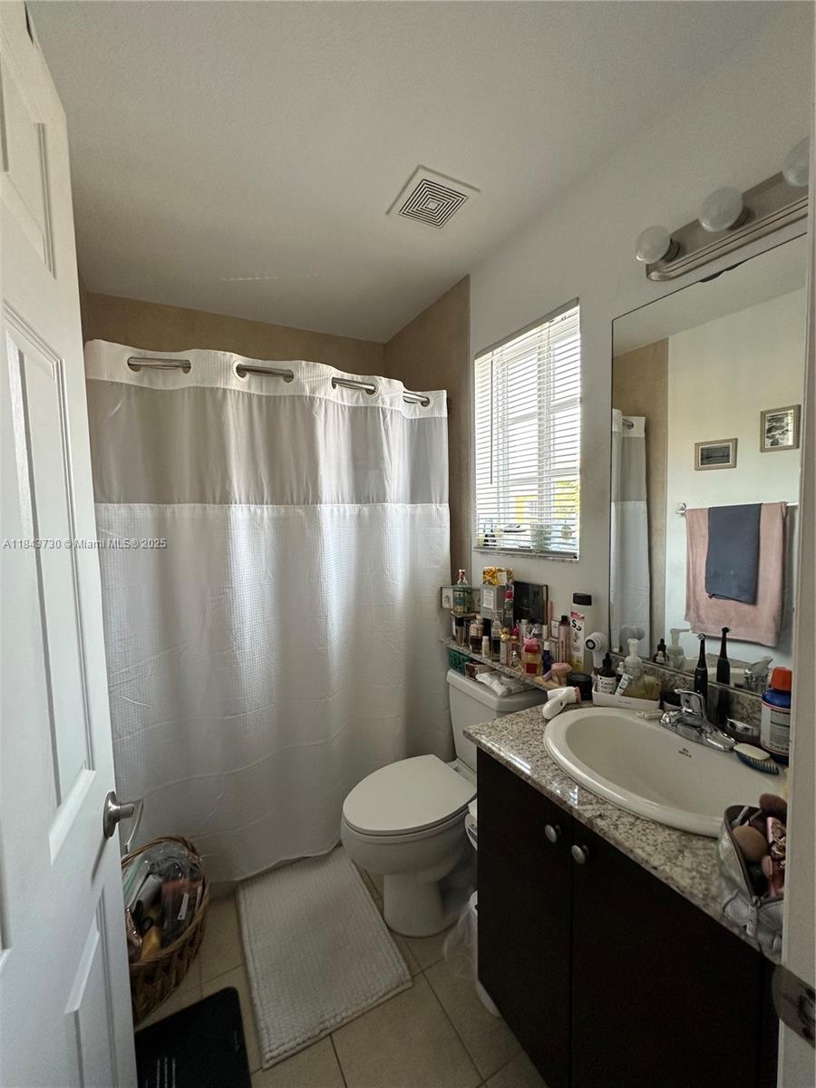 141 Northwest 2nd Avenue, Unit 2 Hallandale Beach, FL 33009 - Photo 14 of 21 a bathroom with a sink toilet and shower