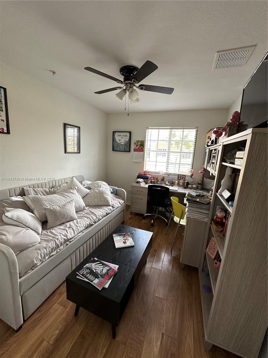 141 Northwest 2nd Avenue, Unit 2 Hallandale Beach, FL 33009 - Photo 17 of 21 a living room with furniture rug and window