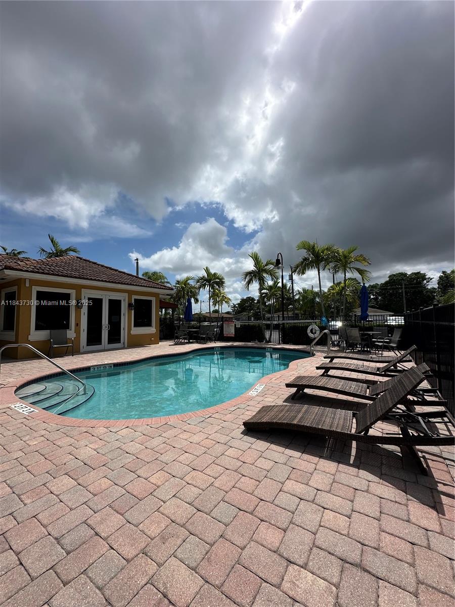141 Northwest 2nd Avenue, Unit 2 Hallandale Beach, FL 33009 - Photo 18 of 21 a car parked in front of a house
