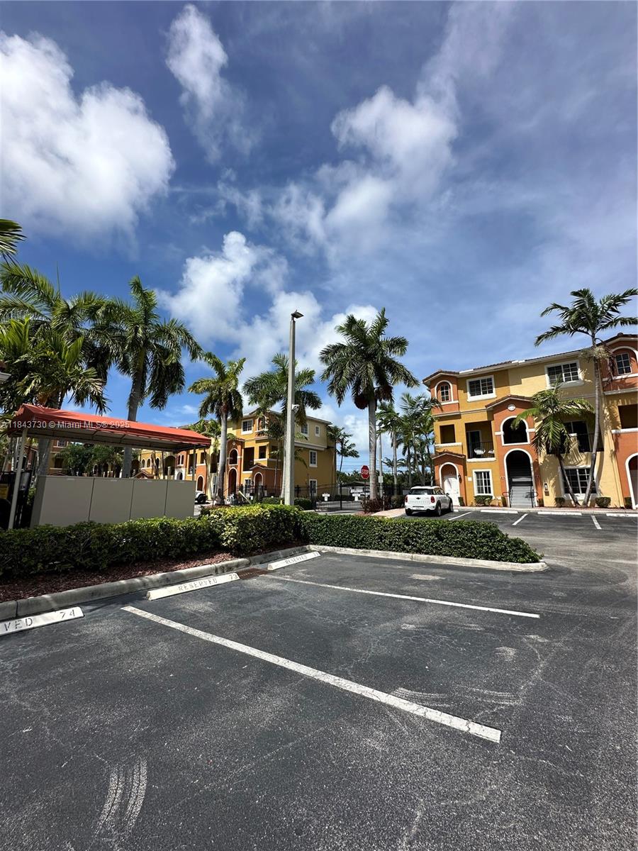 141 Northwest 2nd Avenue, Unit 2 Hallandale Beach, FL 33009 - Photo 2 of 21 a view of street with parked cars