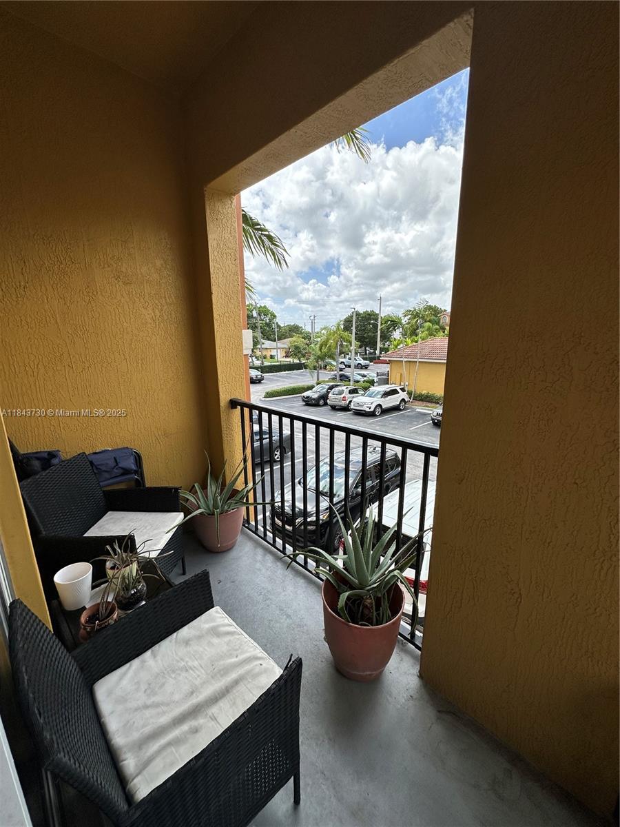 141 Northwest 2nd Avenue, Unit 2 Hallandale Beach, FL 33009 - Photo 3 of 21 a living room with furniture and a potted plant