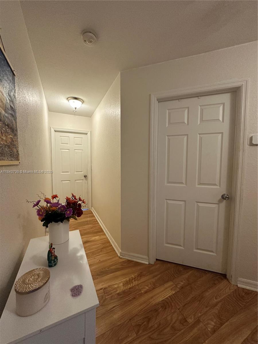 141 Northwest 2nd Avenue, Unit 2 Hallandale Beach, FL 33009 - Photo 10 of 21 a view of a room that has a couch