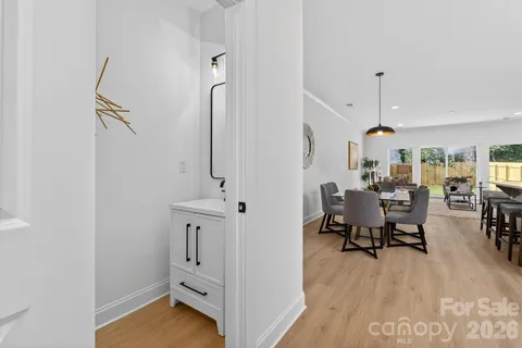 a view of a livingroom with furniture and hardwood floor