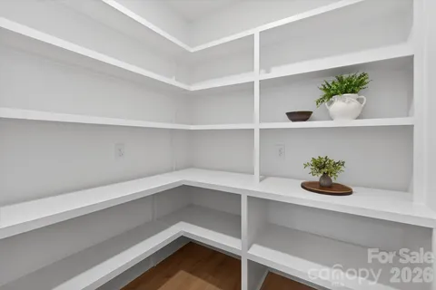 a shelf with a vase of flowers on it