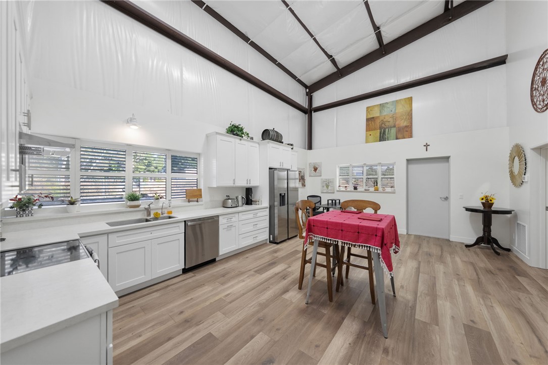 35825 Meadow Ridge Road Temecula, CA 92592 - Photo 64 of 75 a kitchen with a sink cabinets and wooden floor