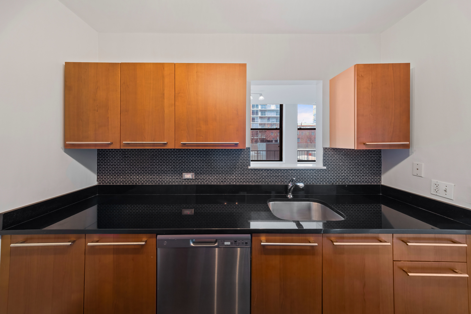 780 South Federal Street, Unit 407 Chicago, IL 60605 - Photo 13 of 20 a kitchen with a sink and cabinets