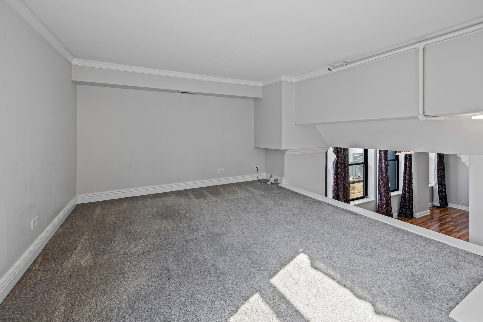 780 South Federal Street, Unit 407 Chicago, IL 60605 - Photo 14 of 20 a view of an empty room with stairs
