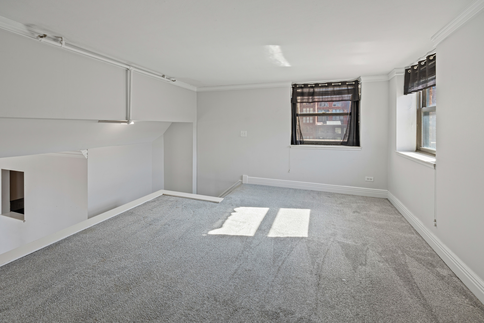 780 South Federal Street, Unit 407 Chicago, IL 60605 - Photo 15 of 20 a view of an empty room with a window
