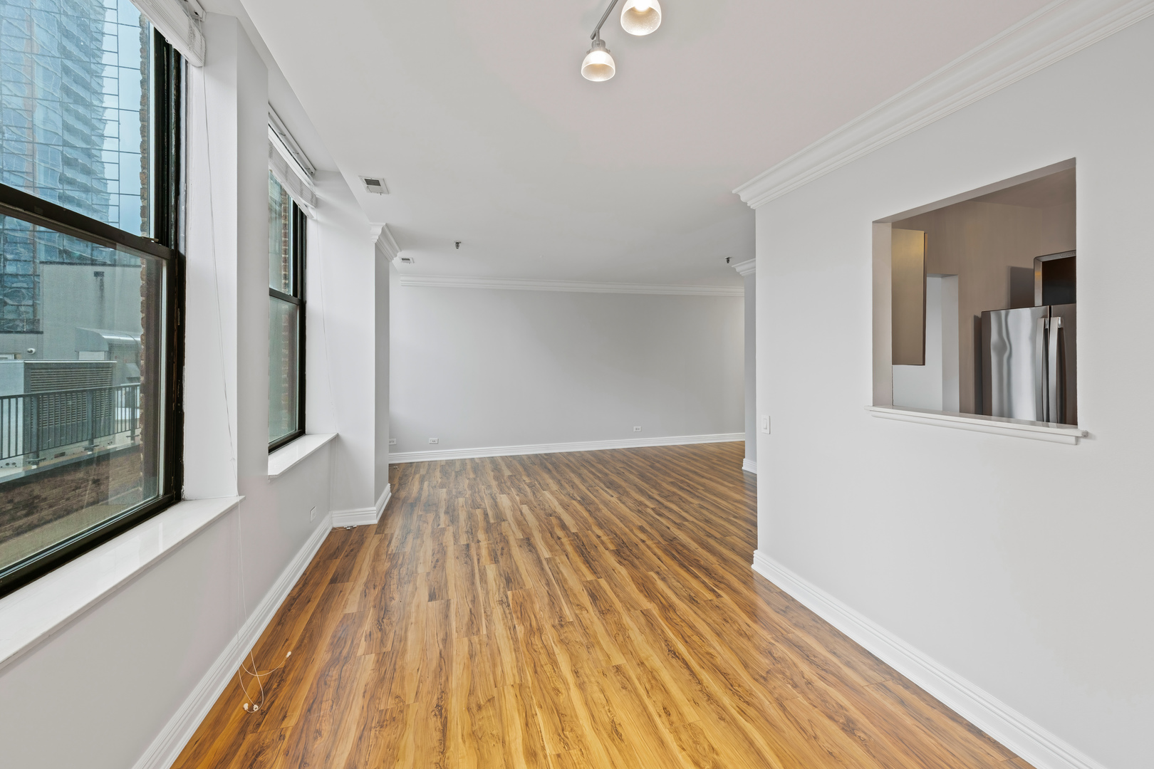 780 South Federal Street, Unit 407 Chicago, IL 60605 - Photo 10 of 20 a view of a room with wooden floor and a fireplace