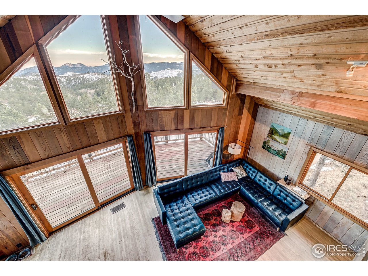 1048 Dixon Road Boulder, CO 80302 - Photo 21 of 39 a view of an empty room with wooden floor and windows