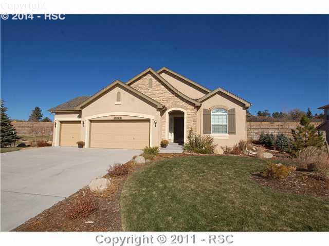 2328 Rusty Ridge Court Colorado Springs, CO 80921 - Photo 1 of 16 Fully landscaped with Stucco Exterior, 3-Car Garage with Epoxy flooring, and southern exposure makes this the ideal home!
