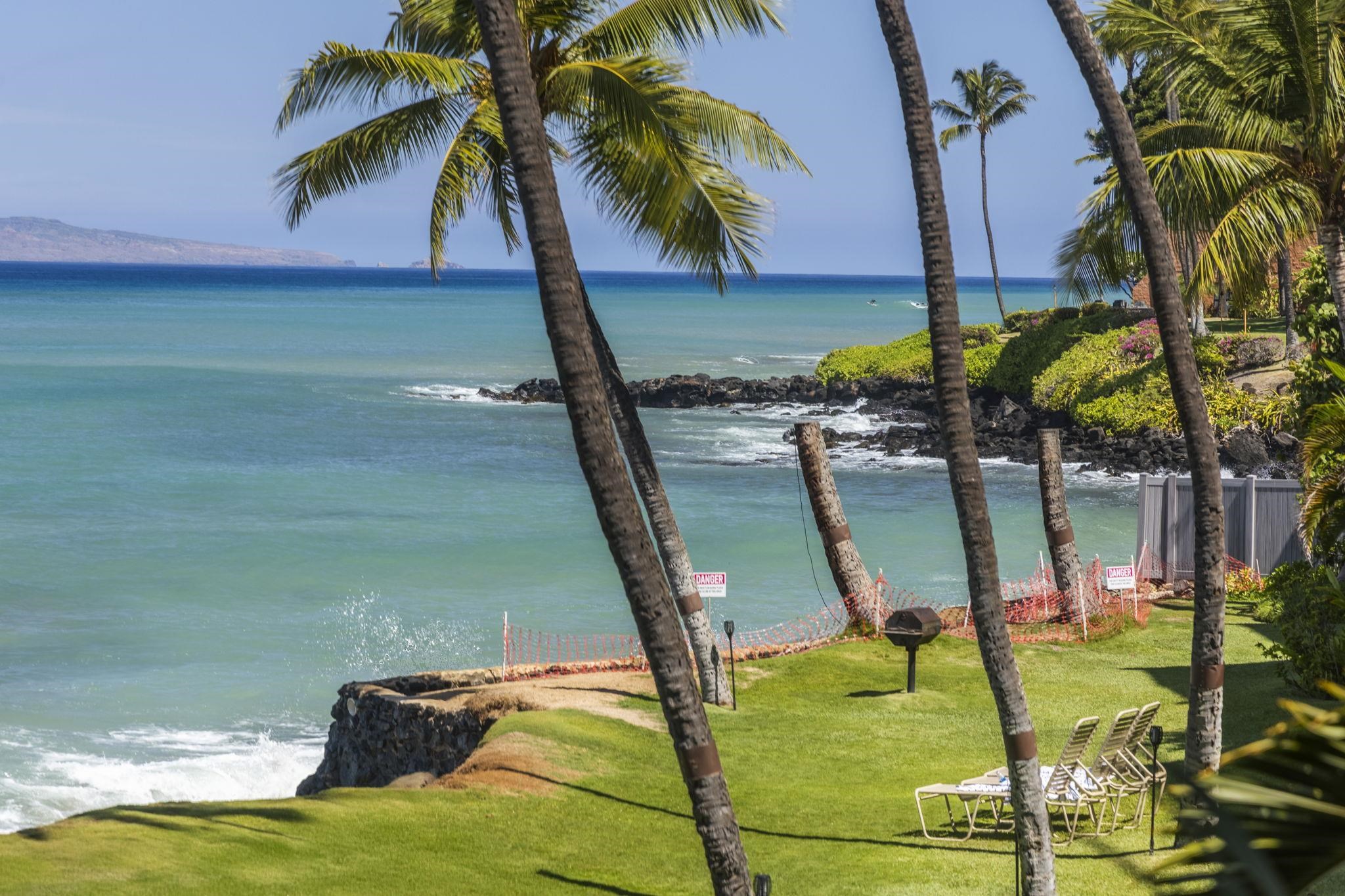 3875 Lower Honoapiilani Road, Unit B205 Lahaina, HI 96761 - Photo 22 of 28 a view of swimming pool with a table and chairs