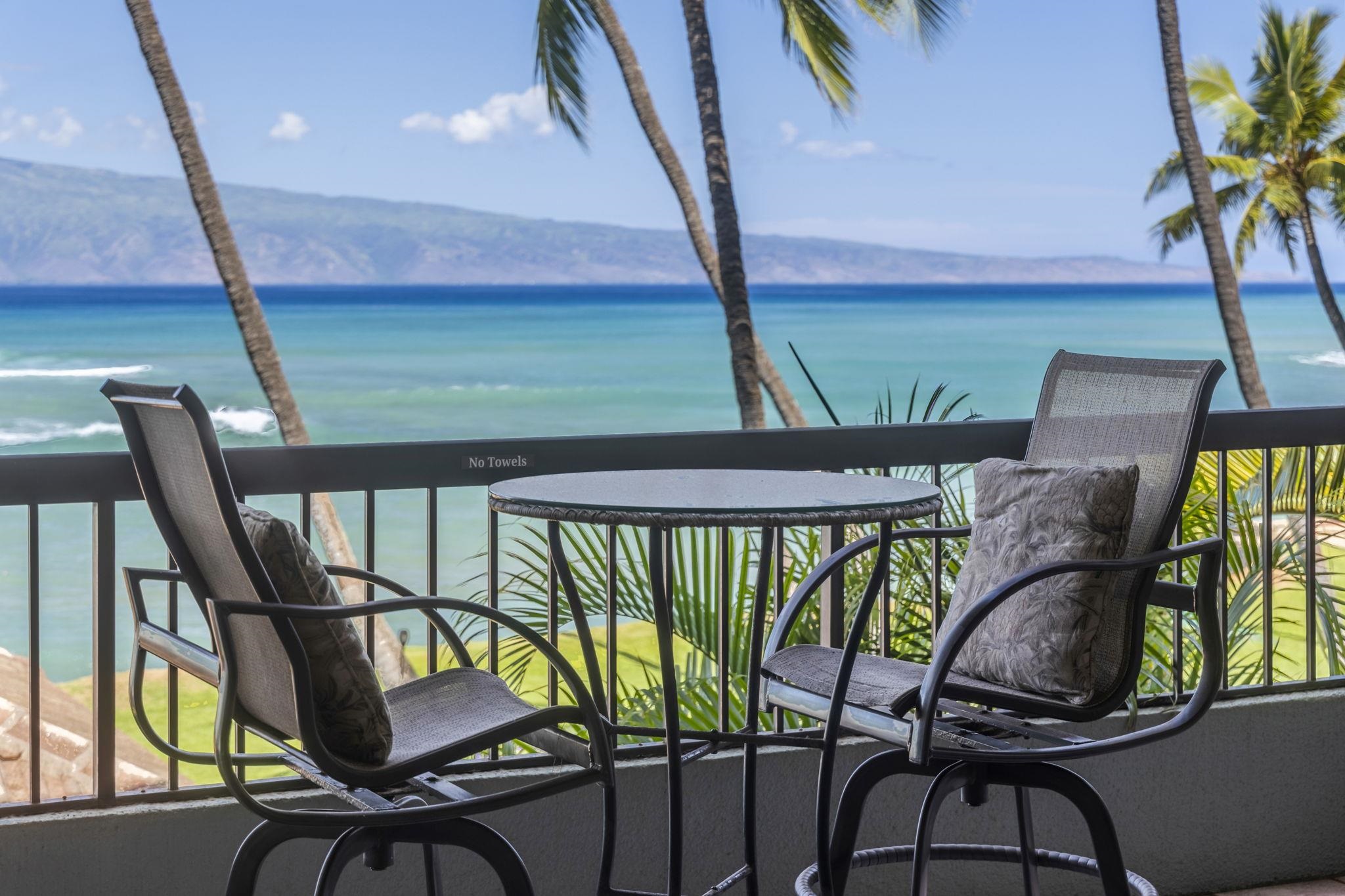 3875 Lower Honoapiilani Road, Unit B205 Lahaina, HI 96761 - Photo 3 of 28 a view of a chairs and table in patio