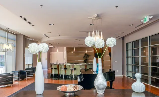 a dining room with furniture and chandelier